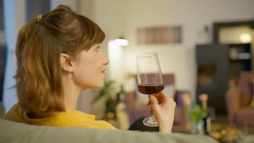 Woman drinking red wine at home, Edersee vacation home, Kellerwald vacation home