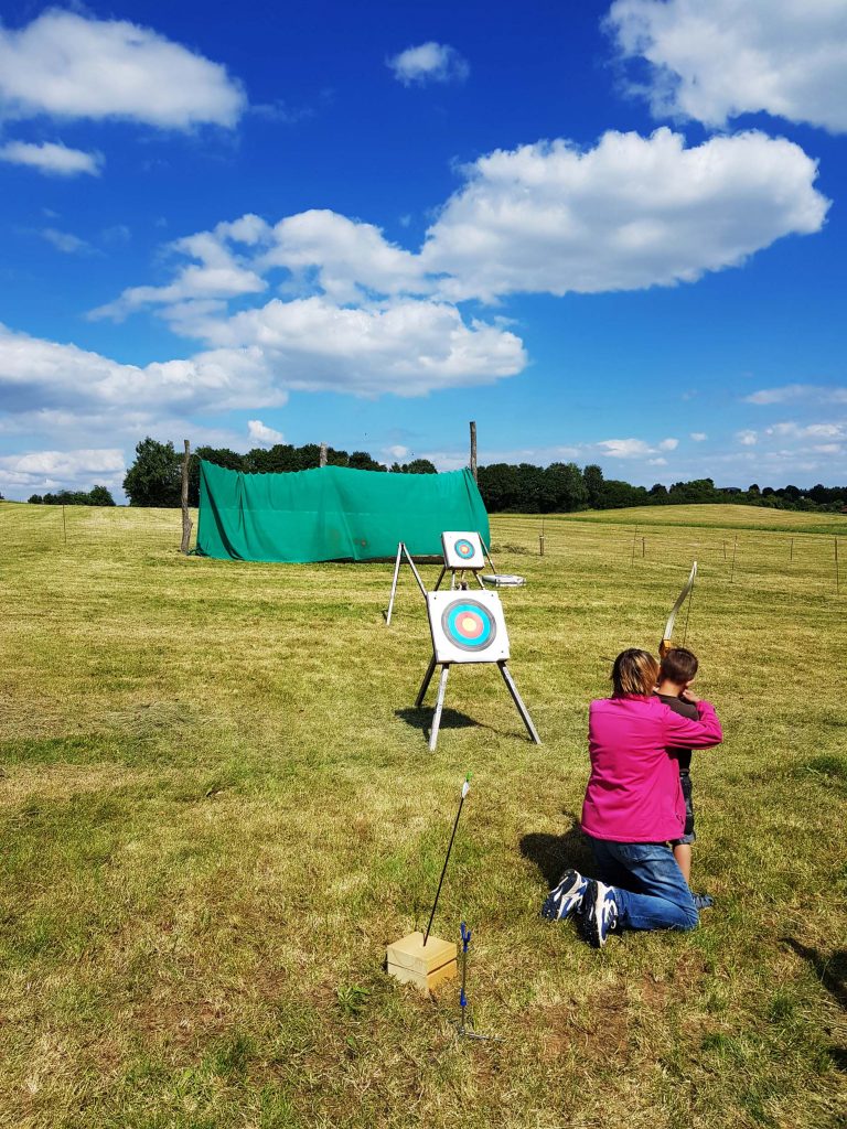 Outdoor archery in a meadow with children, Vacation Home Edersee, Vacation Home Kellerwald