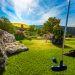 Adventure Golf Edersee, family playing mini-golf on sunny course in picturesque landscape, vacation home Edersee, vacation home Kellerwald